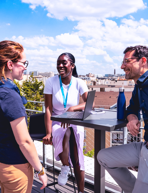 87seconds Group colleagues talking on a rooftop